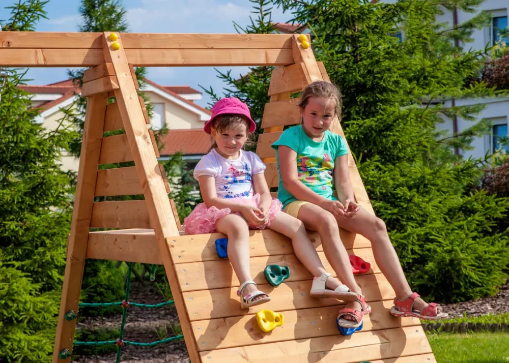 Teak color swing extension module climbing wall